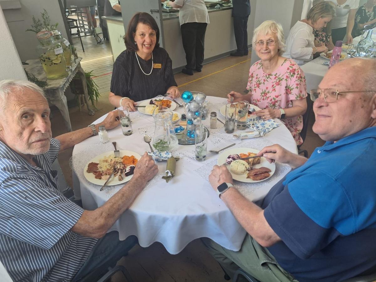 Senior-Management-enjoying-Christmas-lunch-with-residents-1